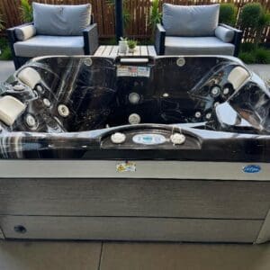 Outdoor spa hot tub with lounge chairs