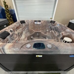 Marble-patterned showroom hot tub with multiple jets